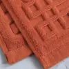 Anti Rutsch Baumwolle Badematte in Terrakotta, texturiertes Design, ideal für Badezimmer.