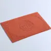Badematte Baumwolle orange mit filigranem Muster, ideal für Badezimmer.
