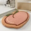 Badematte mit Pfirsich-Design, weiches Material, fröhliches Badezimmer-Deko-Element.