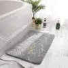 Badematte Steinoptik grau mit goldfarbenen Marmorlinien, ideal für modernes Badezimmer.