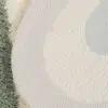 Runde Badezimmermatte mit texturiertem Oberflächenmuster und weicher Kante.