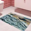 Blauer Badezimmerteppich mit Wellenmuster, modernes Design für Badezimmer.