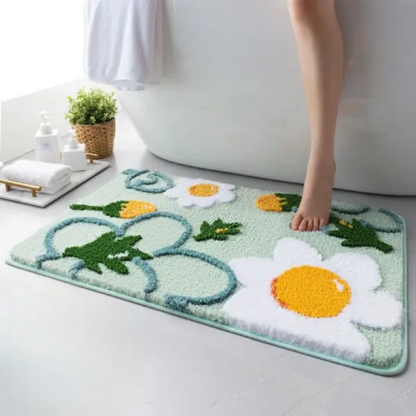 Badezimmerteppich mit Blumenmuster, weiches Material, grün-weiß-gelb, ideal für Bad und Dusche.