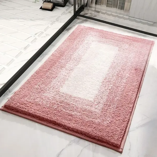 Pink Badezimmerteppich mit weissem Zentrum, weiches Material, modernes Badezimmer-Design.