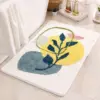 Skandinavischer Badezimmerteppich mit Blattmotiv, weiss, grün, gelb, blau, flauschig, Badezimmer-Teppich.