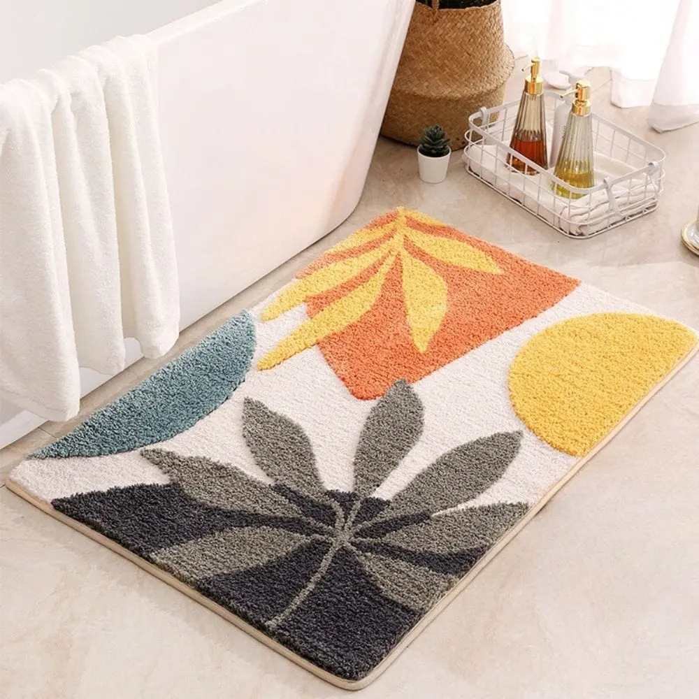 Skandinavischer Badezimmerteppich mit Blattmuster in Orange, Gelb und Grau, ideal für moderne Badezimmer.