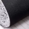 Schwarzer Badteppich Art-Déco mit anti-rutschiger Oberfläche und weißer Strukturunterseite.