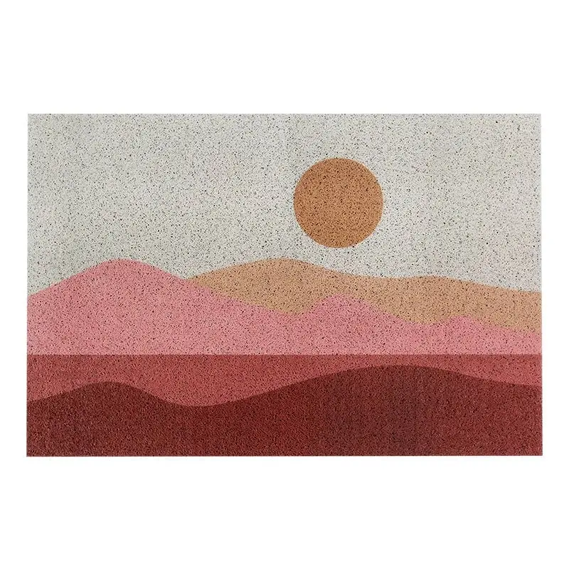 Badteppich Art-Déco mit stilisiertem Sonnenmotiv und sanften Farbverläufen in Rot- und Terrakottatönen.