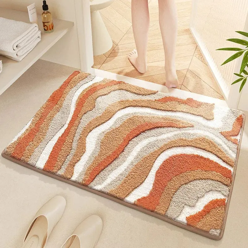 Badteppich Baumwolle mit wellenförmigem Muster in Orange und Grau, ideal für Badezimmer.