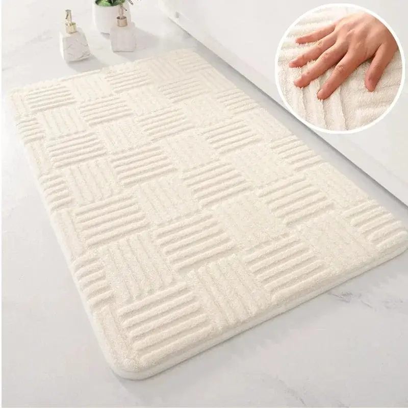 Weisser Badteppich mit geometrischem Muster, weiches Material, ideal für Badezimmer.