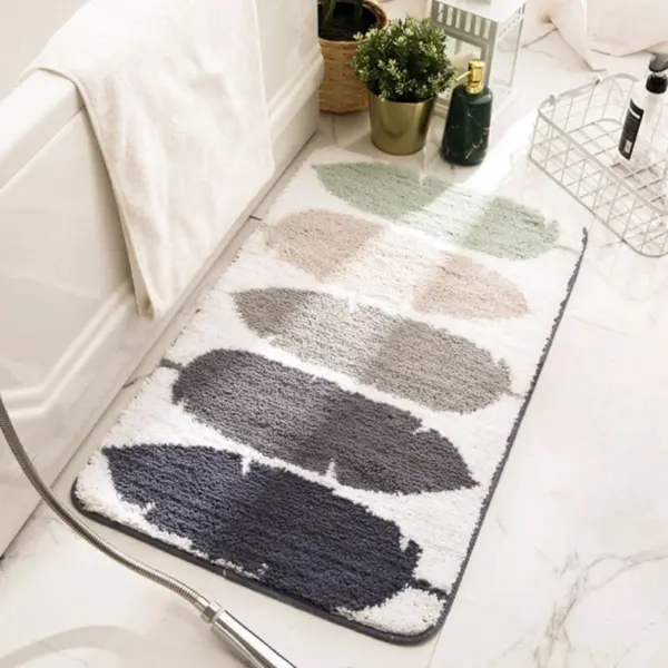 Badteppich Frottee mit Blattmuster in Grau- und Grüntönen, weiches Material, ideal für Badezimmer.