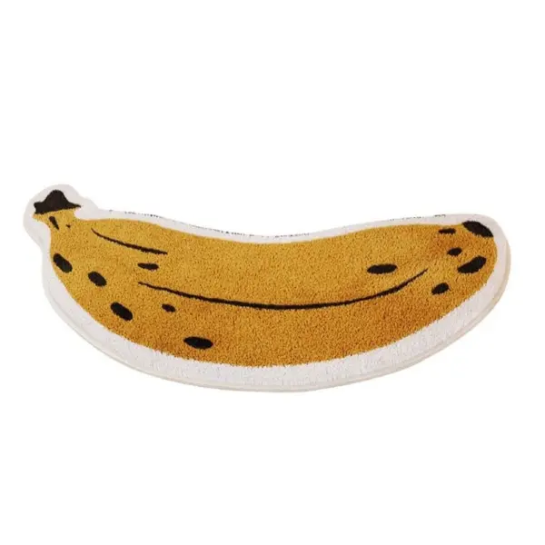 Badteppich in Form einer Banane, gelb mit schwarzen Flecken, fruchtig und spaßig fürs Badezimmer.