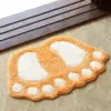 Badteppich Fussform orange-weiß, Badezimmermatte mit Fußabdruck Design, weiches Material.