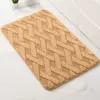 Badteppich mit geometrischem Muster, beige Farbe, ideal für Badezimmer.