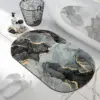 Badteppich Marmoroptik schwarz-grau-gold, runder Badezimmer-Teppich mit luxuriösem Design.