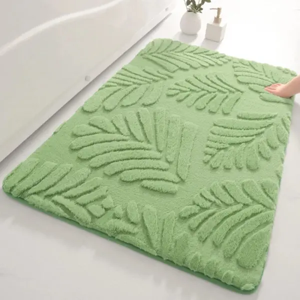 Olivgrüner Badteppich mit Blattmuster, weiches Material, ideal für Badezimmer.
