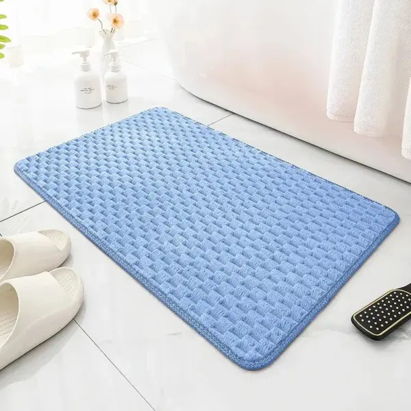 Blauer runder Badteppich mit Struktur, ideal für Badezimmer und Dusche.