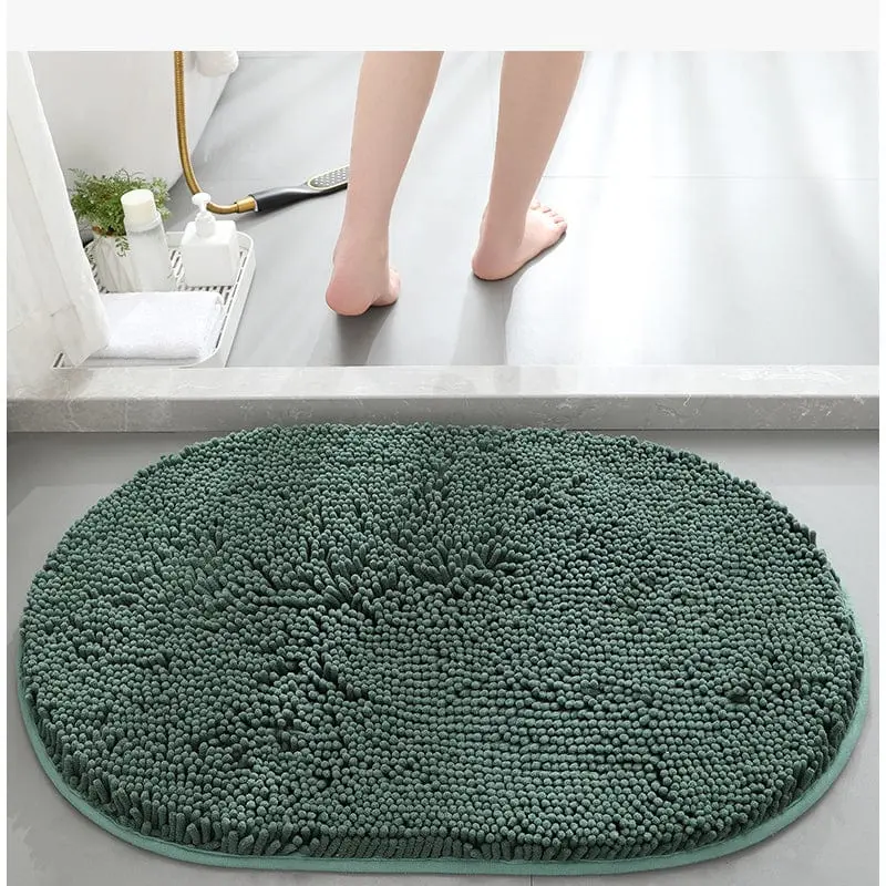Dunkelgrüne Badematte mit Chenille-Struktur, runde Form, ideal für Badezimmer.