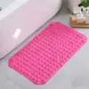 Rutschfester Duschvorleger in Pink mit rutschfesten Punkten, ideal für Badezimmer.