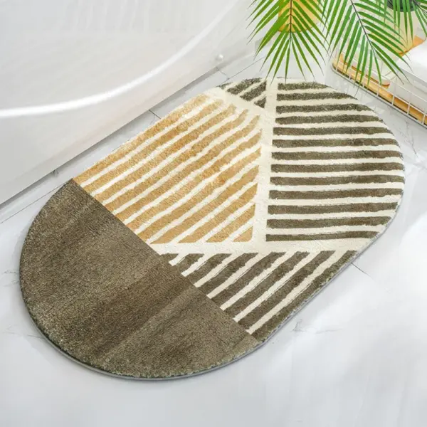 Ovaler Badteppich mit Streifenmuster in Braun- und Beigetönen, ideal für moderne Badezimmer.