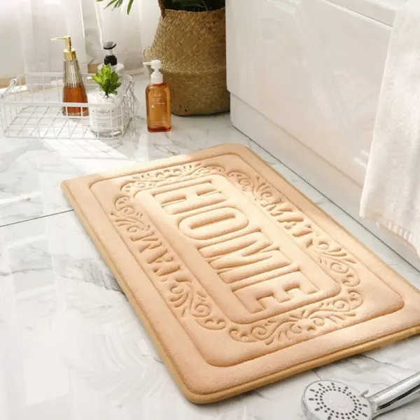 Rechteckige Badematte mit HOME-Relief, beige, für Badezimmer, weich und strapazierfähig.