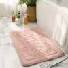 Rechteckige Badematte rosa mit 'HOME'-Aufdruck, für Badezimmer, weich und strapazierfähig.