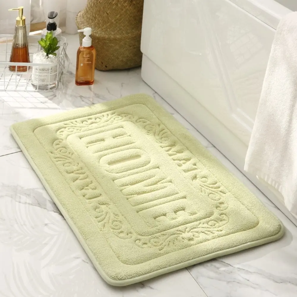 Rechteckige Badematte in hellgrün mit 'HOME' Stickerei, für Badezimmer.