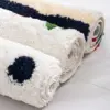 Runde Badematte in verschiedenen Farben und Mustern, weiches Material, ideal für Badezimmer.
