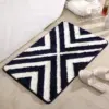 Vintage Badteppich mit schwarz-weißem Chevron-Muster, weiches Material, ideal für Badezimmer.